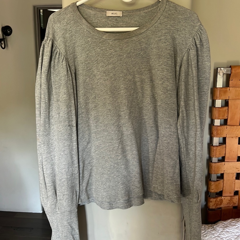 Dressy sweatshirt. No size tag but fits M/L